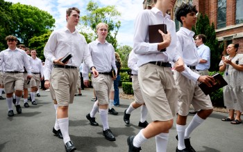 Students walk down drive